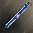 Paracord karkötő - Kék, fehér - Wrestling szőnyeges mintával