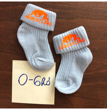 Baba zokni - neon narancssárga összekapaszkodós mintával - világoskék zoknin (0-6hó)