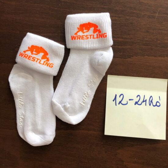 Baba zokni - neon narancssárgasárga összekapaszkodós mintával - fehér zoknin (12-24hó)